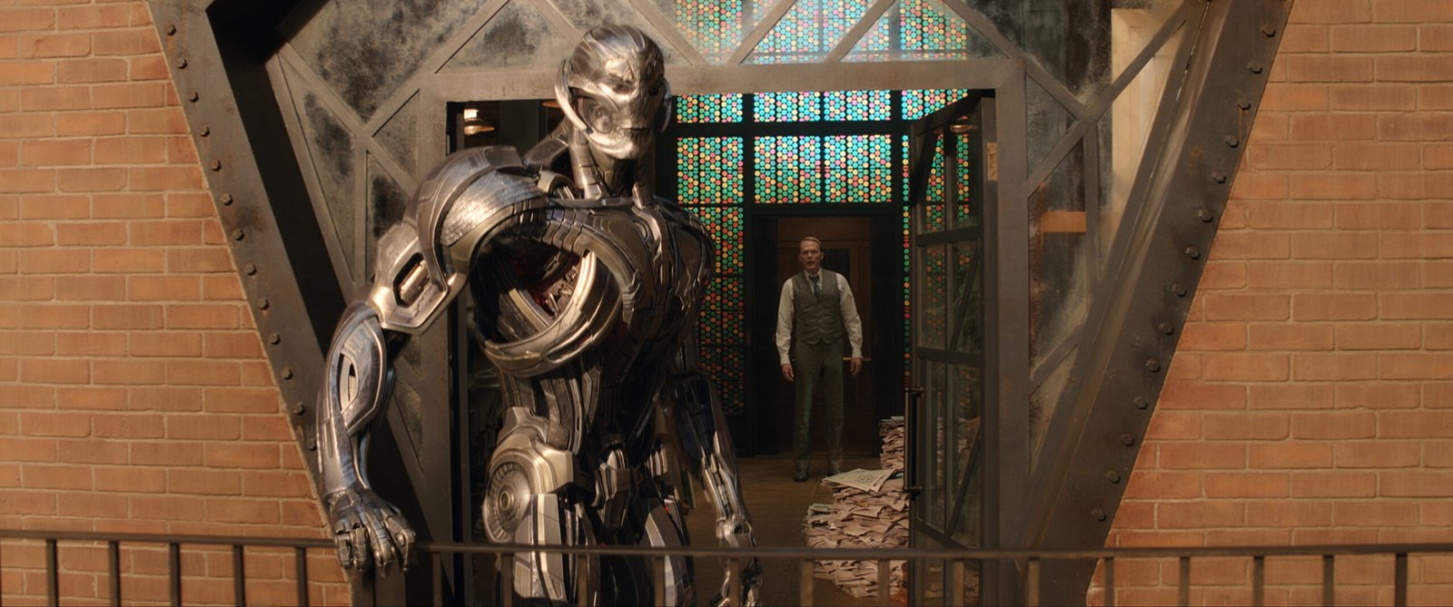 Ultron in his robotic form standing on a balcony in Marvel's VisionQuest